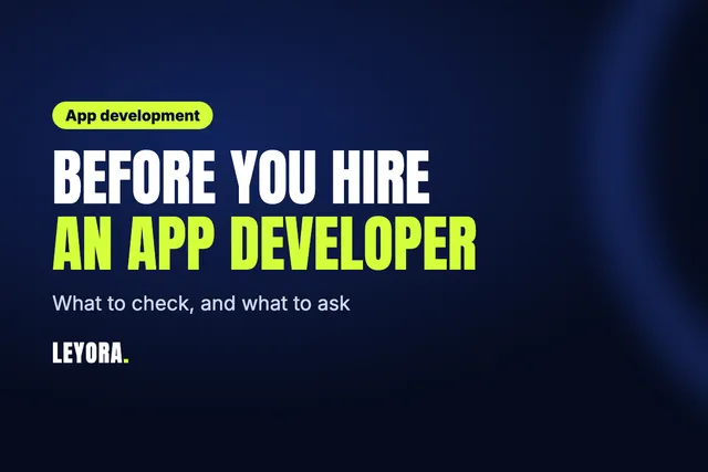 Checklist beside a phone showing an app design